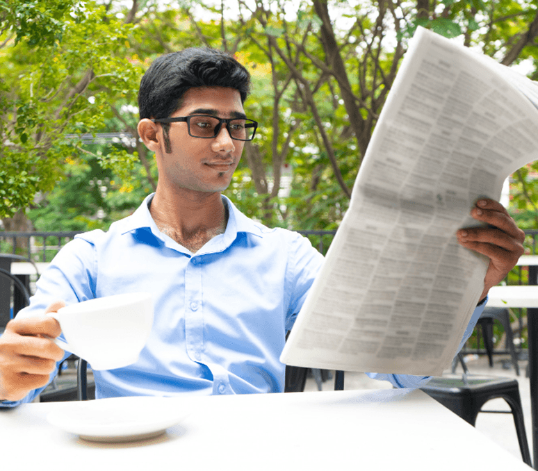 Person reading newspaper